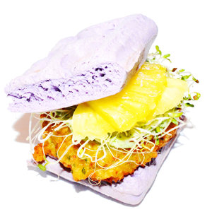 The Dream Burger (Veggie) : A spiced chickpea and sweet corn patty with a cilantro-lime sauce, pickled pineapple slices and fresh alfalfa sprouts, served in between two lavender-coloured waffles.